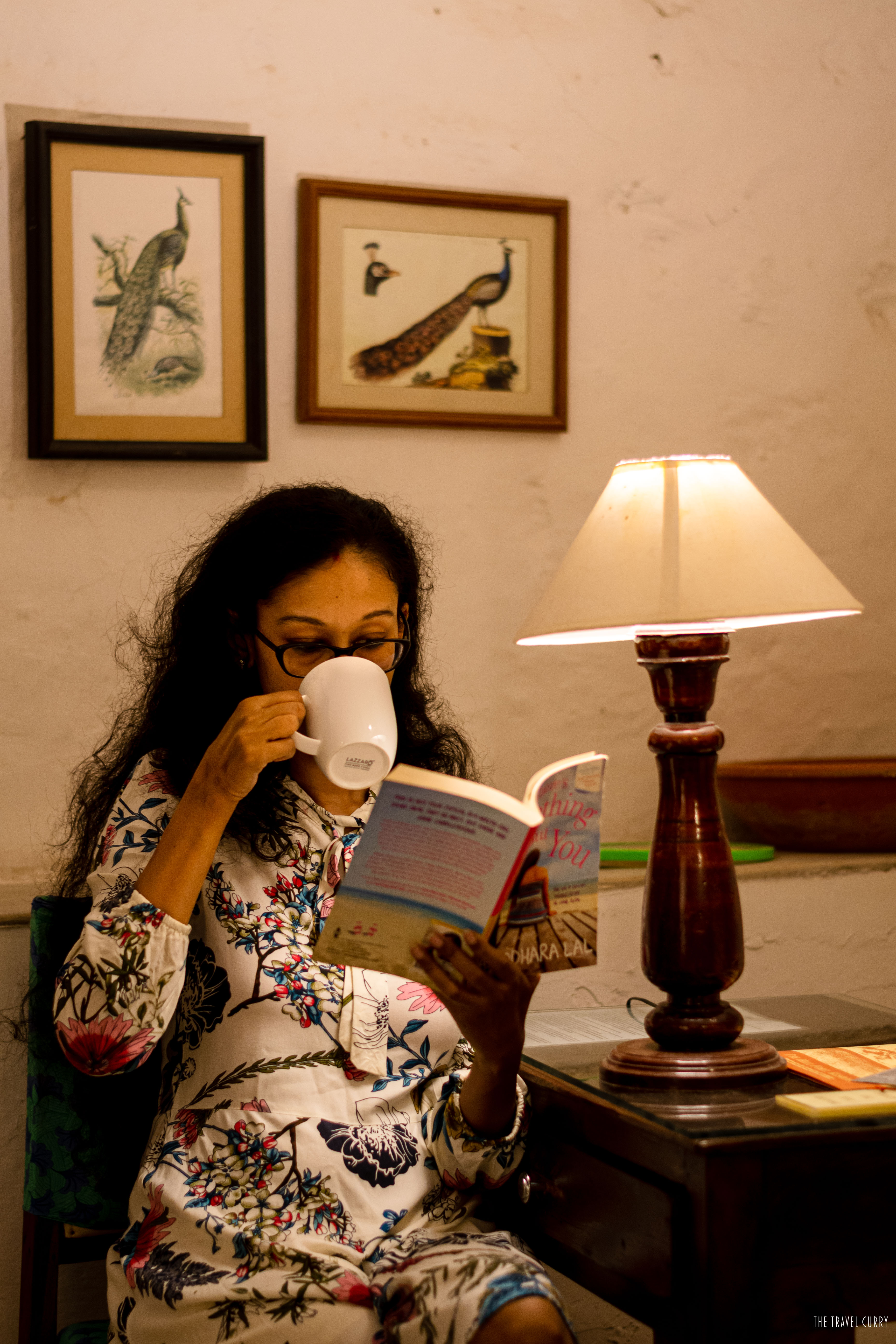 Reading a book in a cozy hotel room of Hill Fort Kesroli