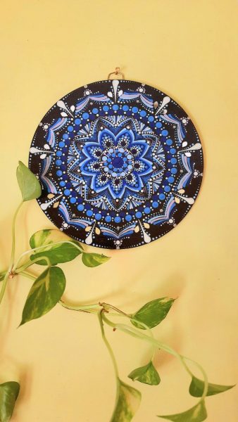Wooden wall plate in colours of evil eye