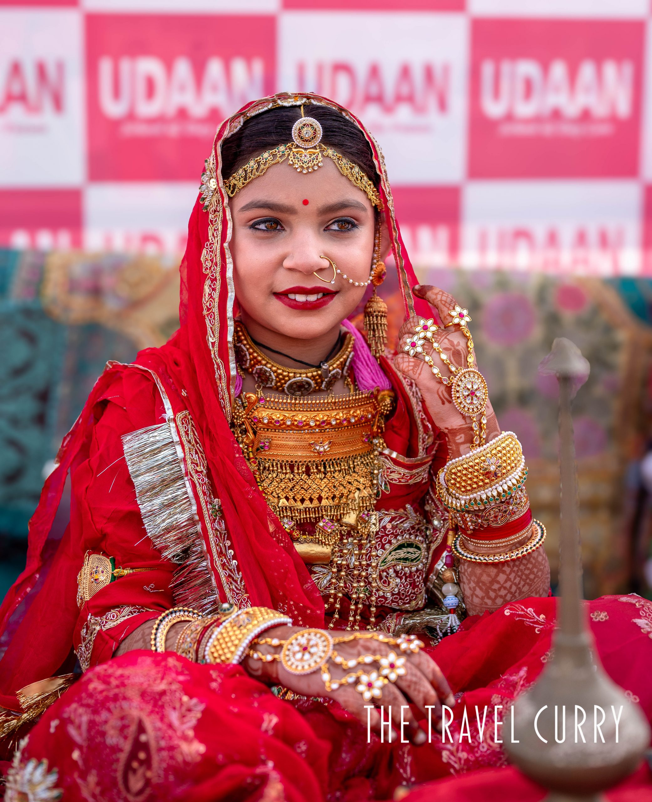 A young school girl dressed as Rajasthani bride